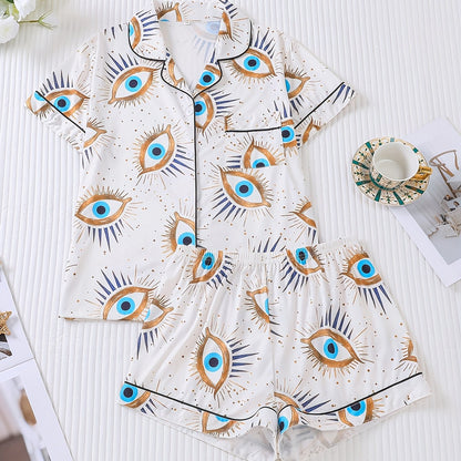 Two Piece Women's Elegant Polyester White Pajama Set with Eye Print, Fabric, All Season Comfort, Short Sleeve Button Top with Collar And Matching Shorts, with All Over Print And Pocket Details, Perfect for Adults Pajama Set